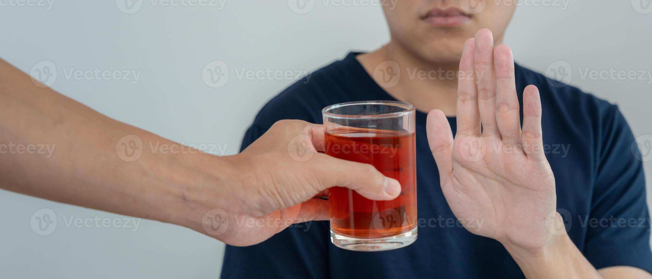 men refuses say no and avoid to drink an alcohol whiskey, stopping hand sign male, alcoholism treatment, alcohol addiction, quit booze, Stop Drinking Alcohol. Refuse Glass liquor, unhealthy, reject photo