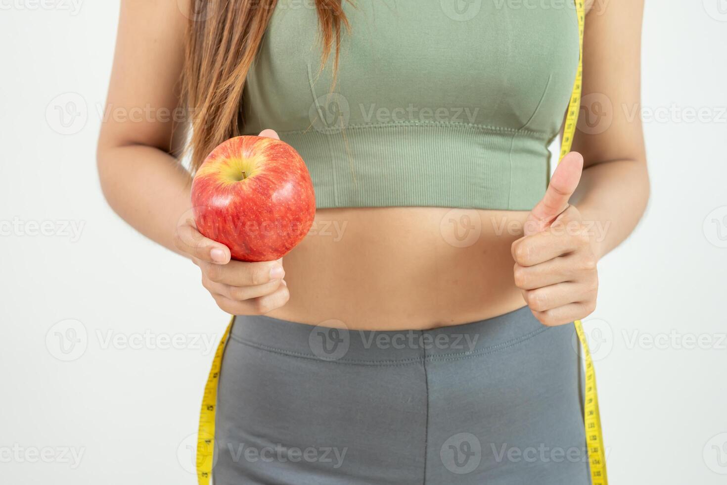 women choose healthy foods, dieting female choose red apple for diet. Good healthy food. weight lose, balance, control, reduce fat, low calories, routines, exercise, body shape. photo