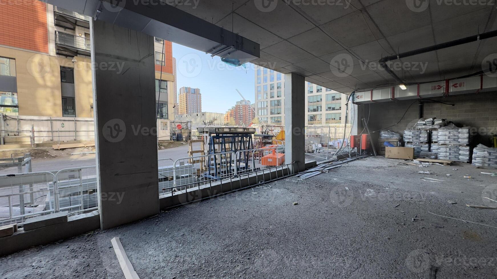Construction Site Interior View with Building Materials and Exterior Buildings. photo