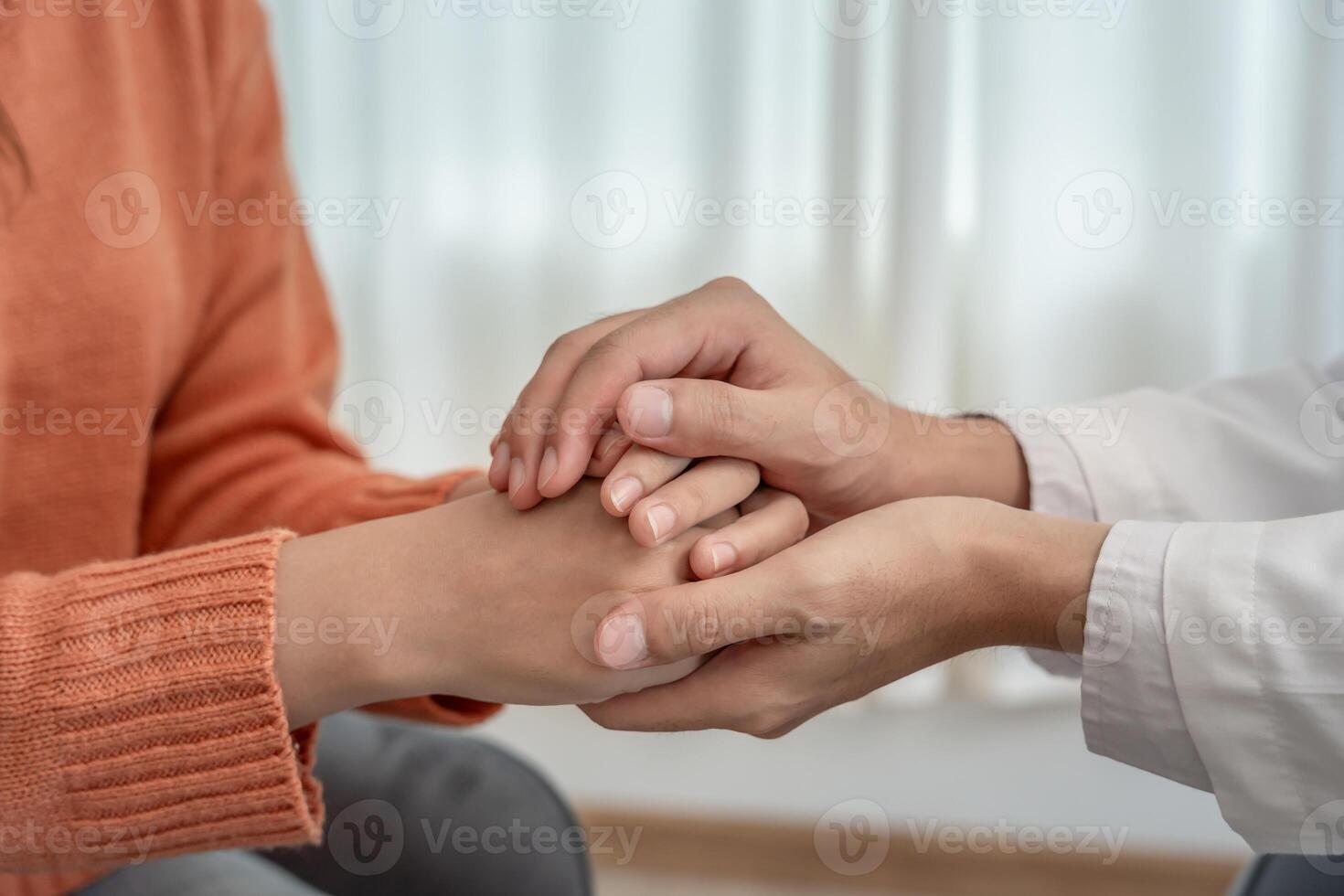 psychiatrist hold hand support each while discussing family issues. doctor encourages and empathy woman suffers depression. psychological, save divorce, Hand in hand together, care photo