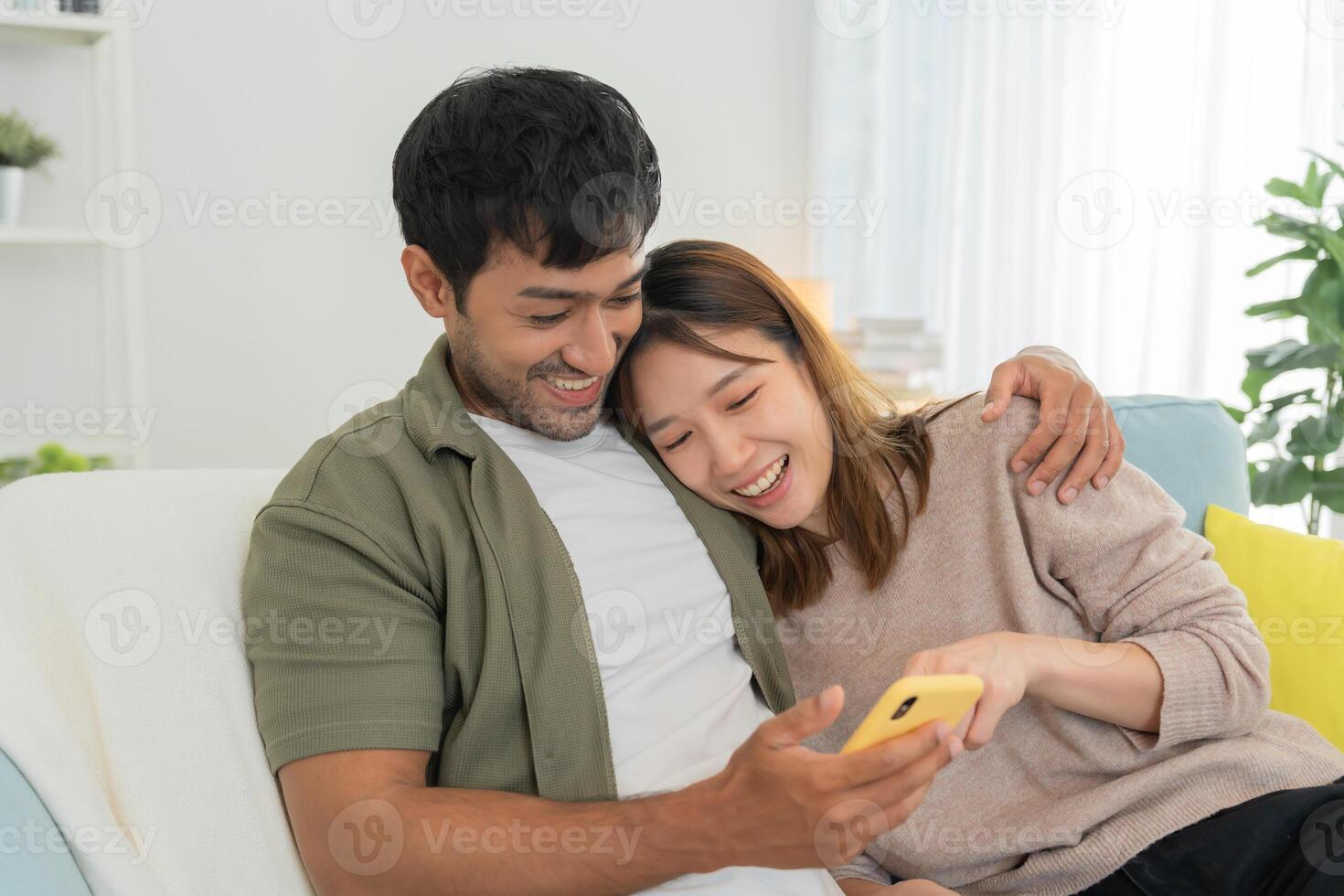 Couple using smartphone for online shopping at home. Hand holding mobile phone with payment detail page display and credit card, stay home, technology, electronic commerce, internet, market place photo