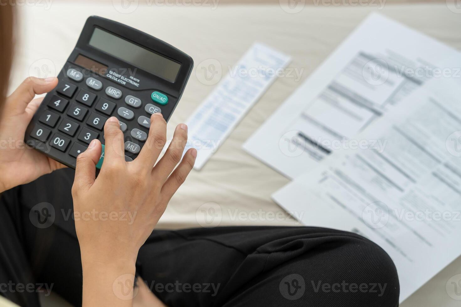 woman with large bills or invoices no money to pay to expenses and credit card debt. shortage, Financial problems, mortgage, loan, bankruptcy, bankrupt, poor, empty wallet photo