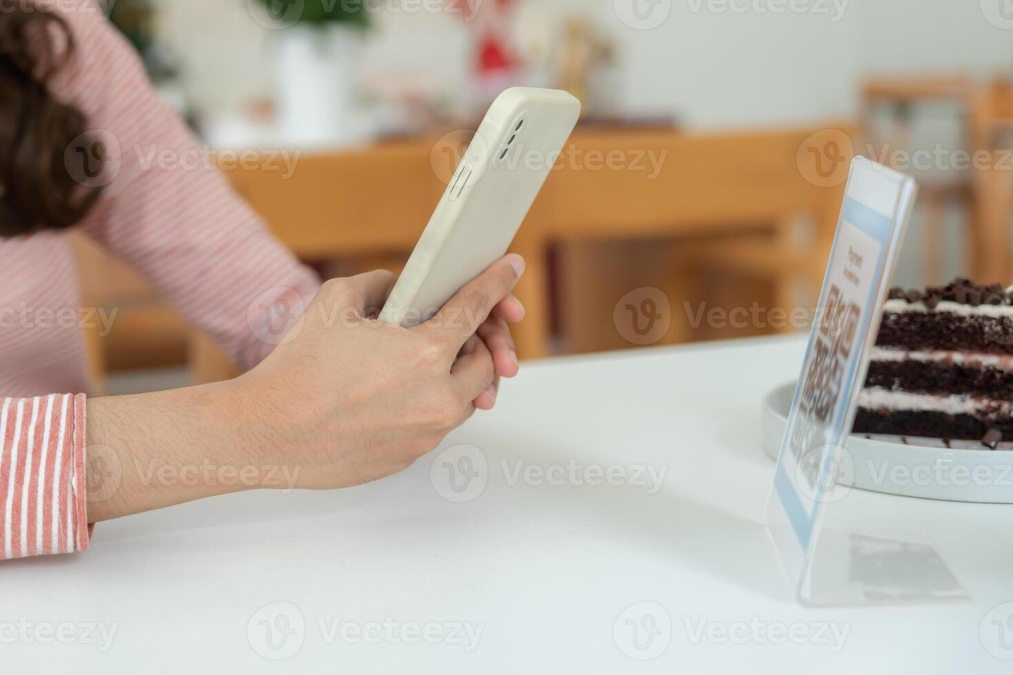 Women use smartphone to scan QR code to pay in cafe restaurant with a digital payment without cash. Choose menu and order accumulate discount. E wallet, technology, pay online, credit card, bank app. photo