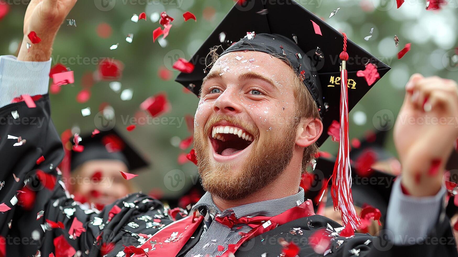 Joyful Graduate Celebrates with Red and Silver Confetti photo
