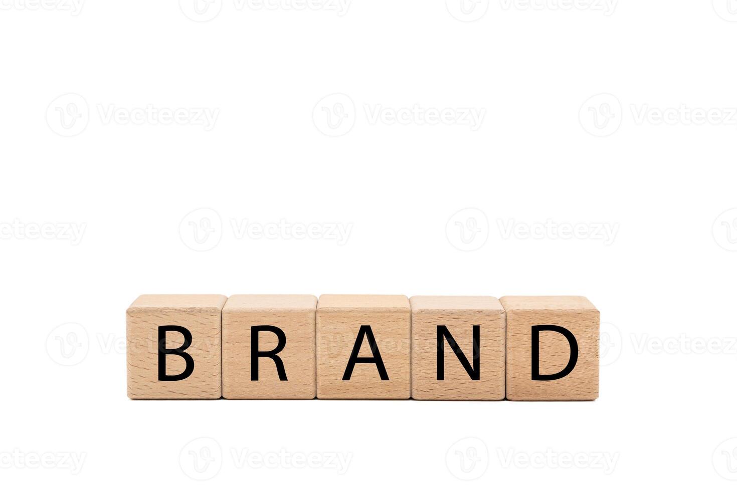 Wooden blocks with BRAND text isolated on white background. Build your Brand. Brand building, success, business. Copy space and clipping path. photo