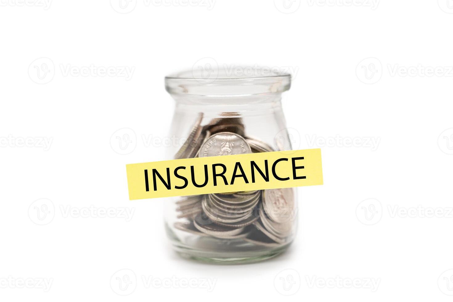 Coins in glass money jar with INSURANCE word on label, Financial Insurance Concept. isolated on white background. Secure Money Planning. Health and Wealth Insurance. photo