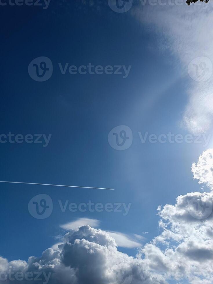 Blue sky background with clouds sun and plain print summer sunny day photo