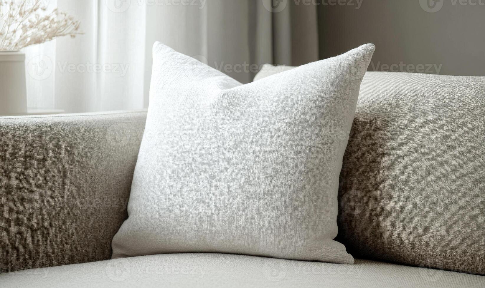 blank white pillow on a couch in front of a window photo