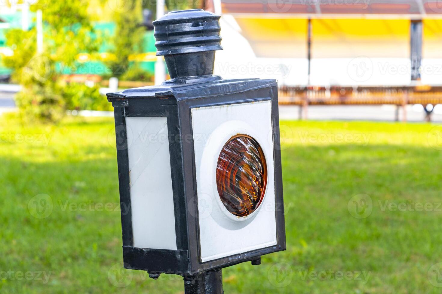 A street light with a circular design on it photo