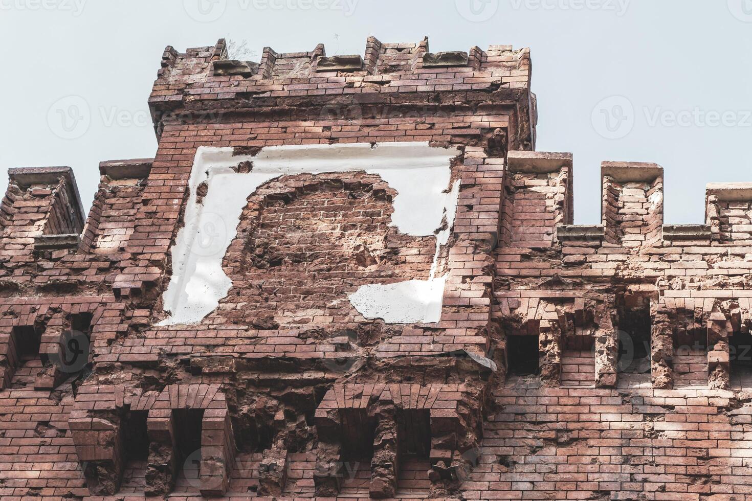 A brick wall with a picture of a man on it photo
