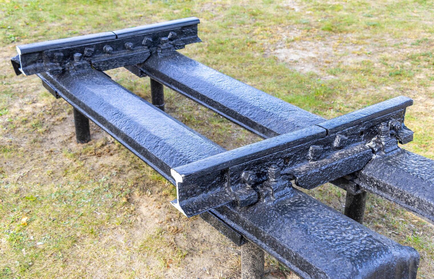 A bench with a metal rail on it photo