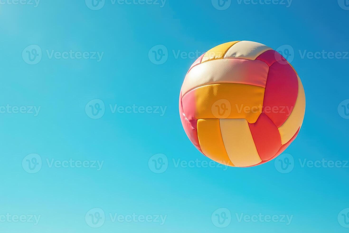 A colorful beach ball flying in the air photo