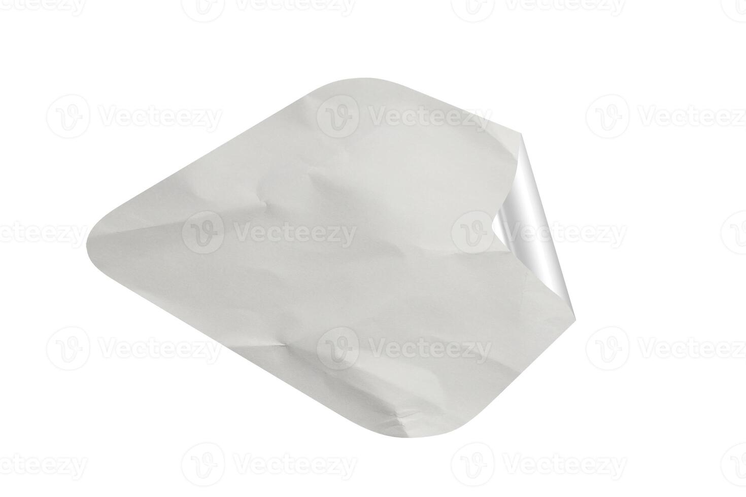 A white piece of paper with a corner cut out photo