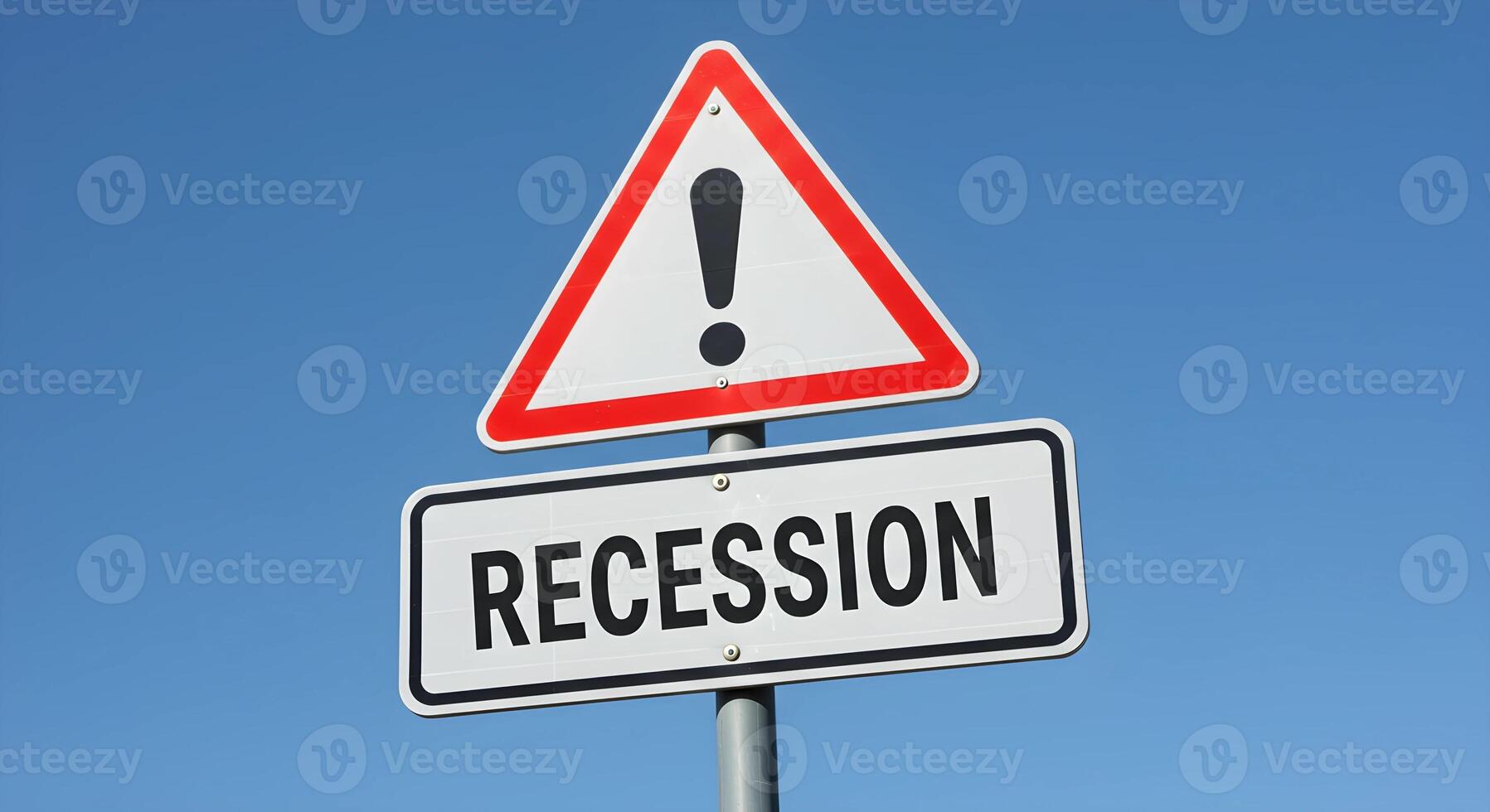 Warning Sign About Economic Recession Against Clear Blue Sky photo