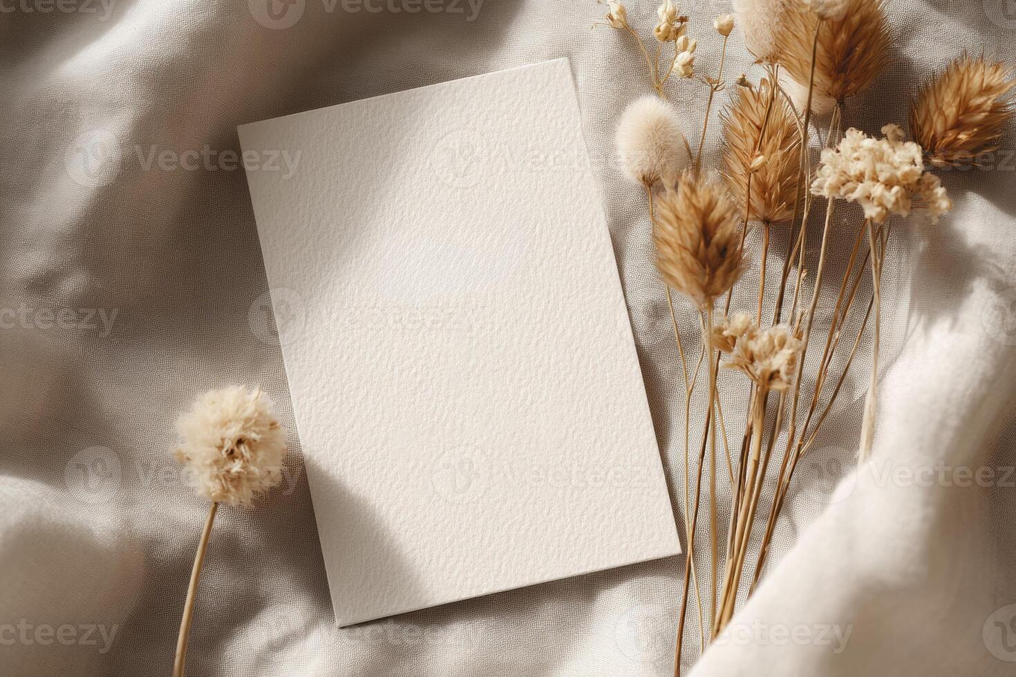 Blank card on a bed with dried grass photo