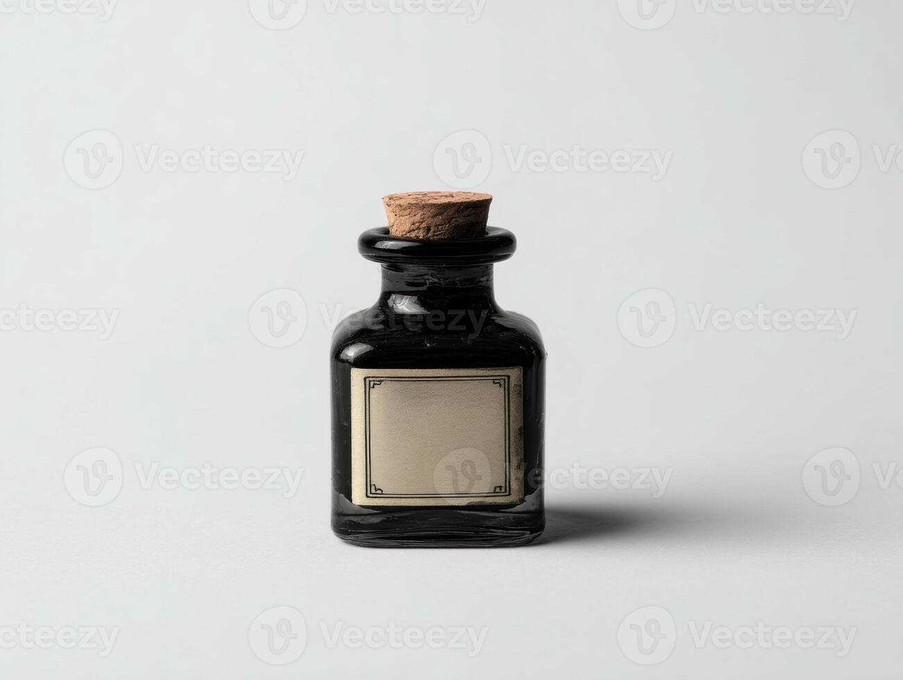 A black bottle with a cork on top photo