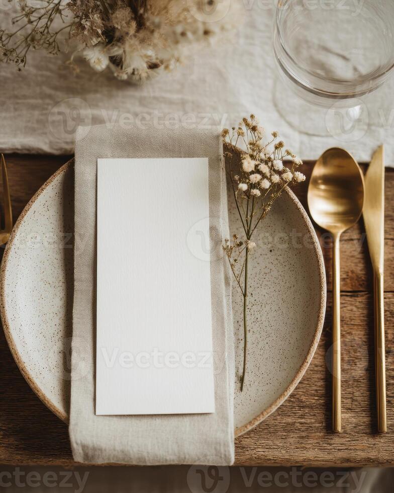 A place setting with a napkin and goldware photo