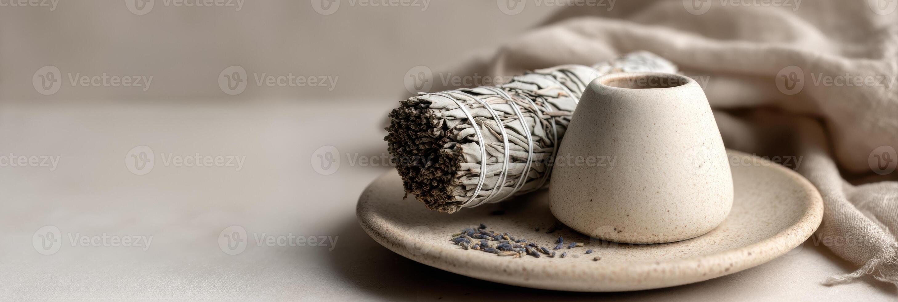 A white vase with a small bowl of herbs photo
