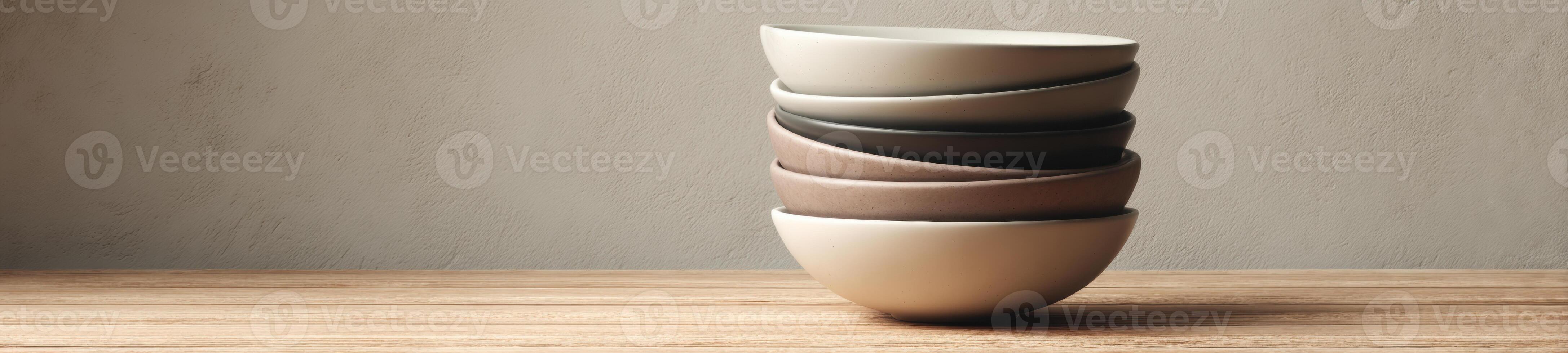 A stack of three vases on a wooden table photo