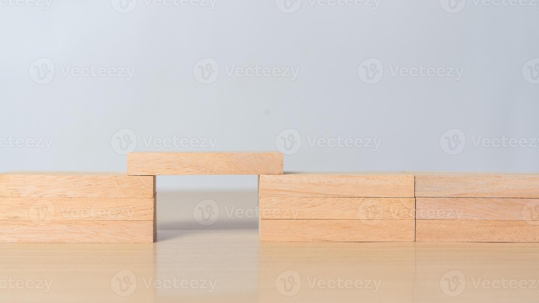 Wooden blocks forming a bridge. Concept of problem solving, connection, teamwork, and building solutions in business and strategy. photo