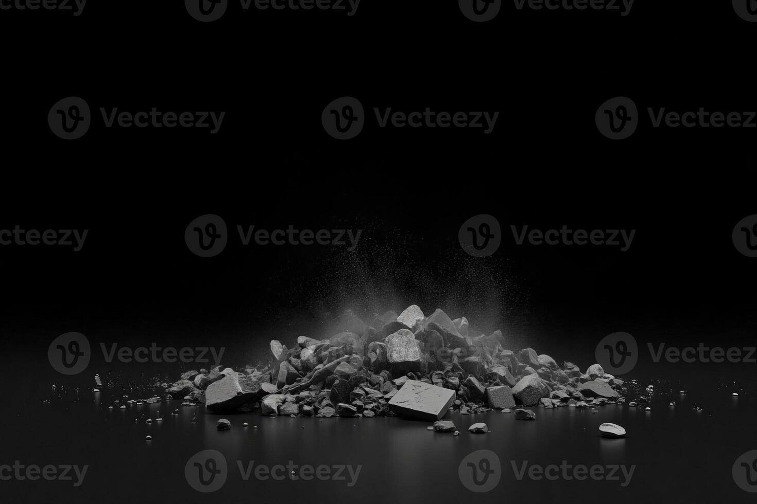 A pile of gray rocks and dust in a black background photo