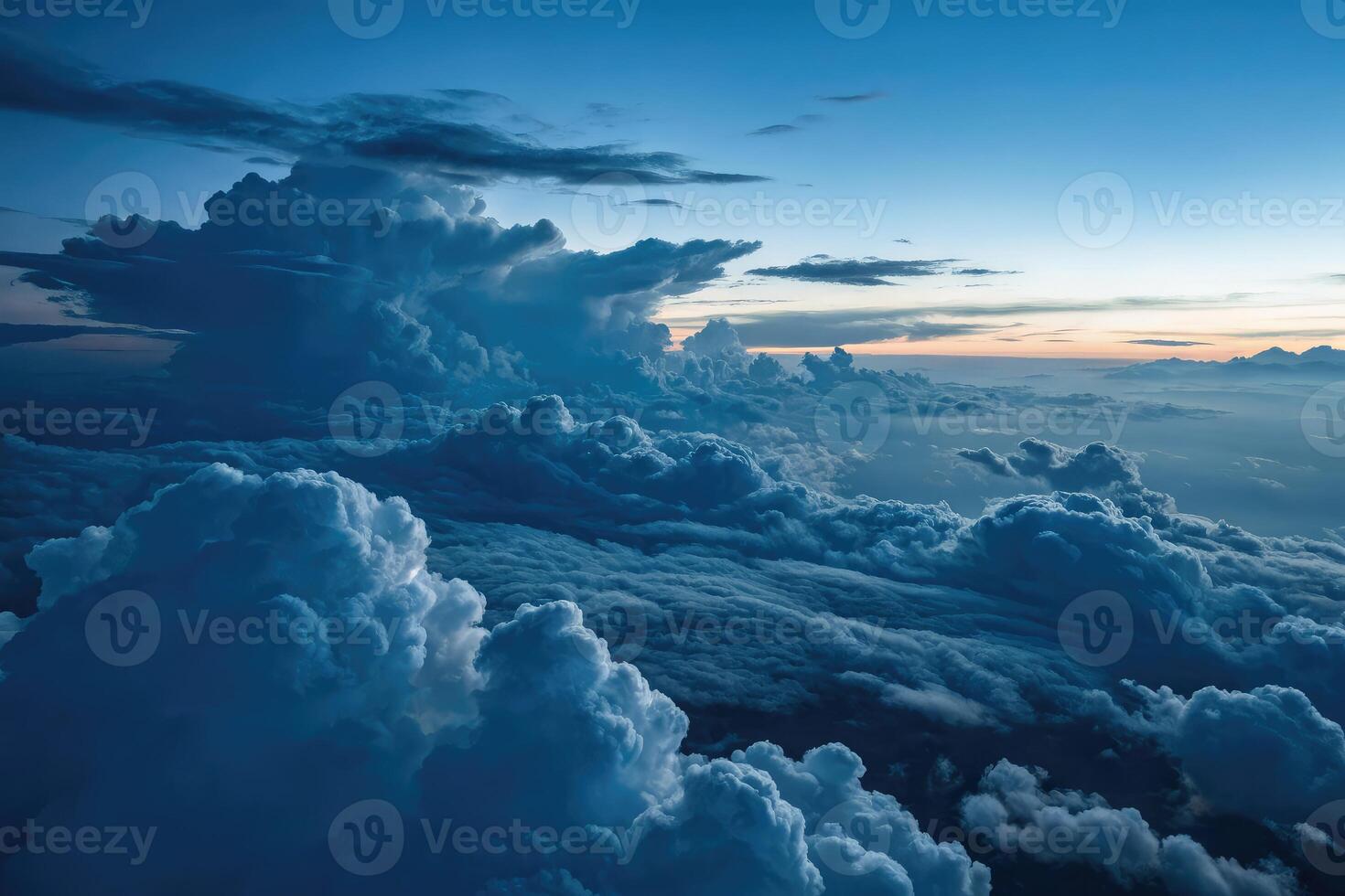 High aerial perspective of glowing stratocumulus clouds at dusk photo
