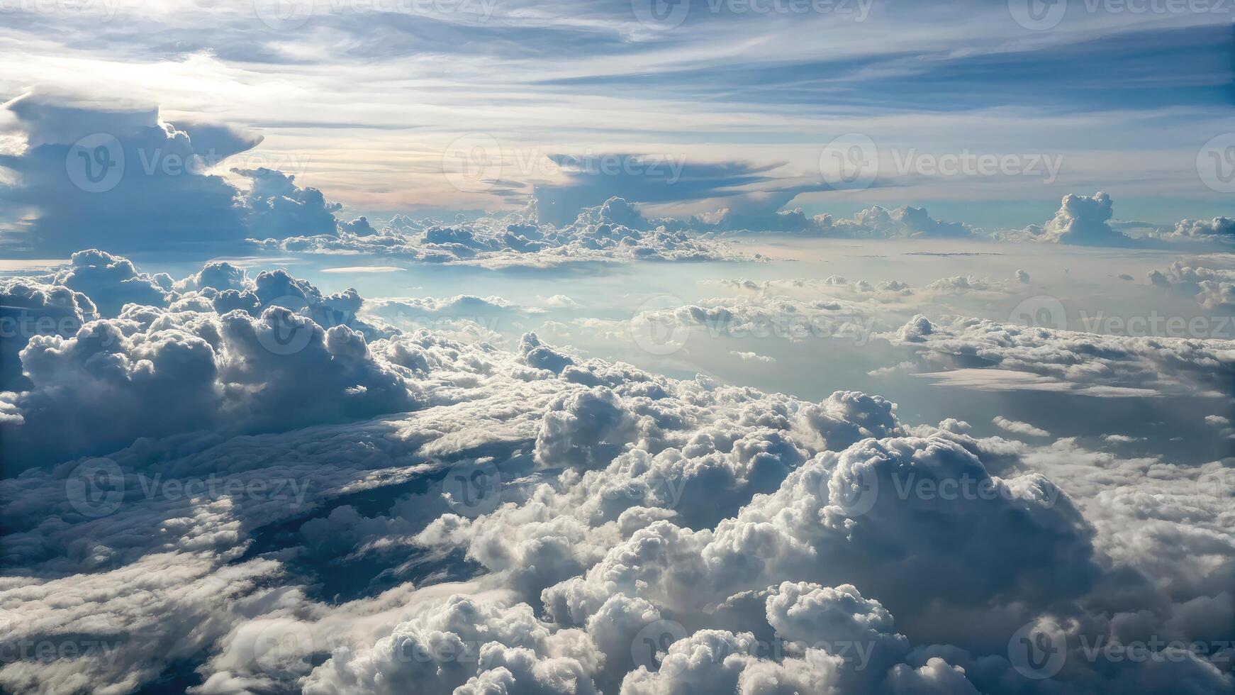 Overhead view of endless flat sheet of clouds against a vibrant sky during daylight hours photo