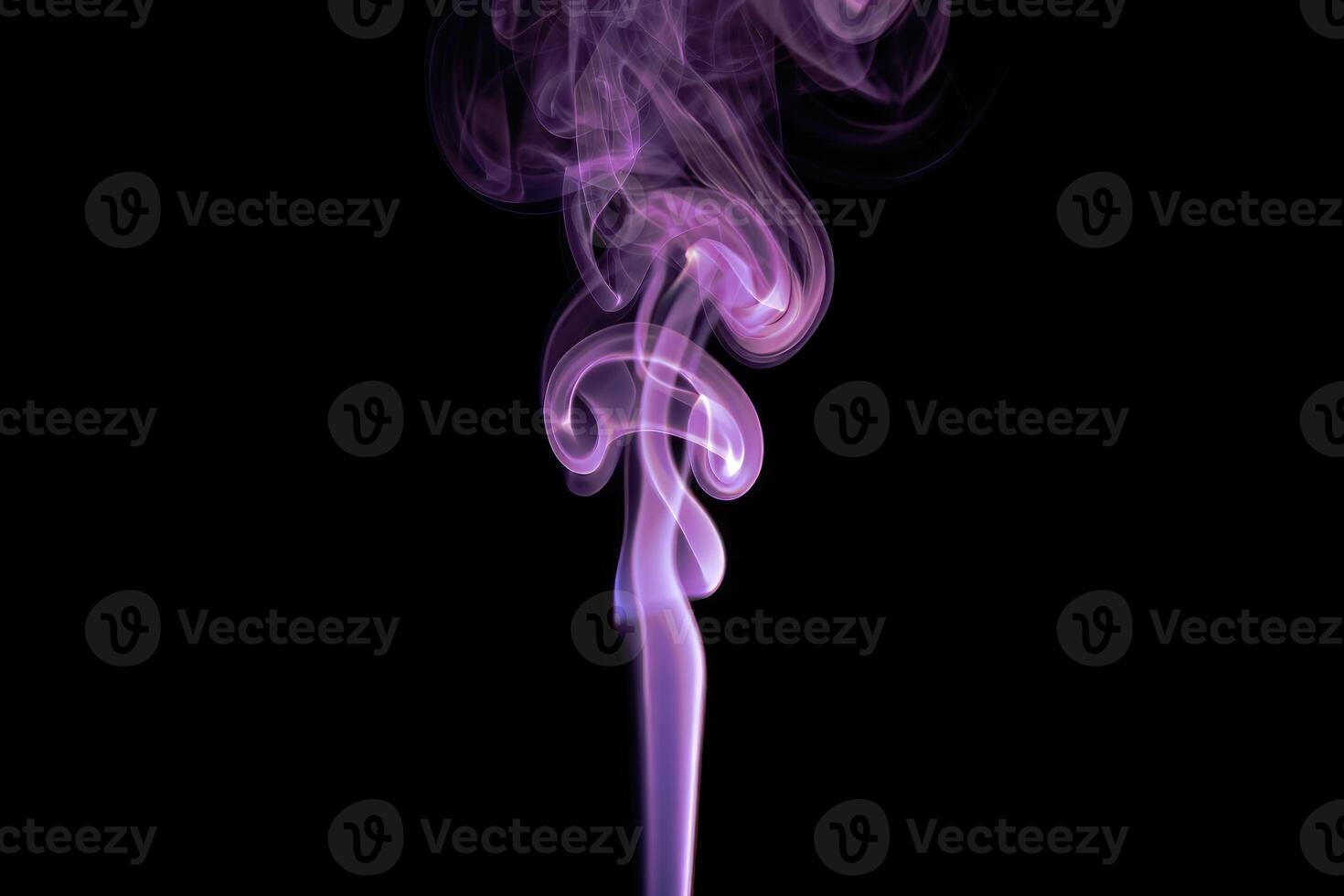 Colorful swirling smoke rising in artistic patterns against a black background photo