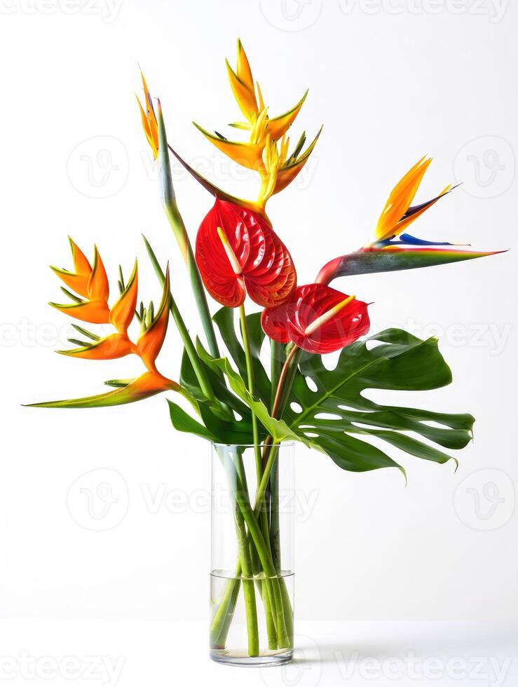 A vibrant and eye-catching bouquet of exotic flowers in a clear glass vase setting. photo