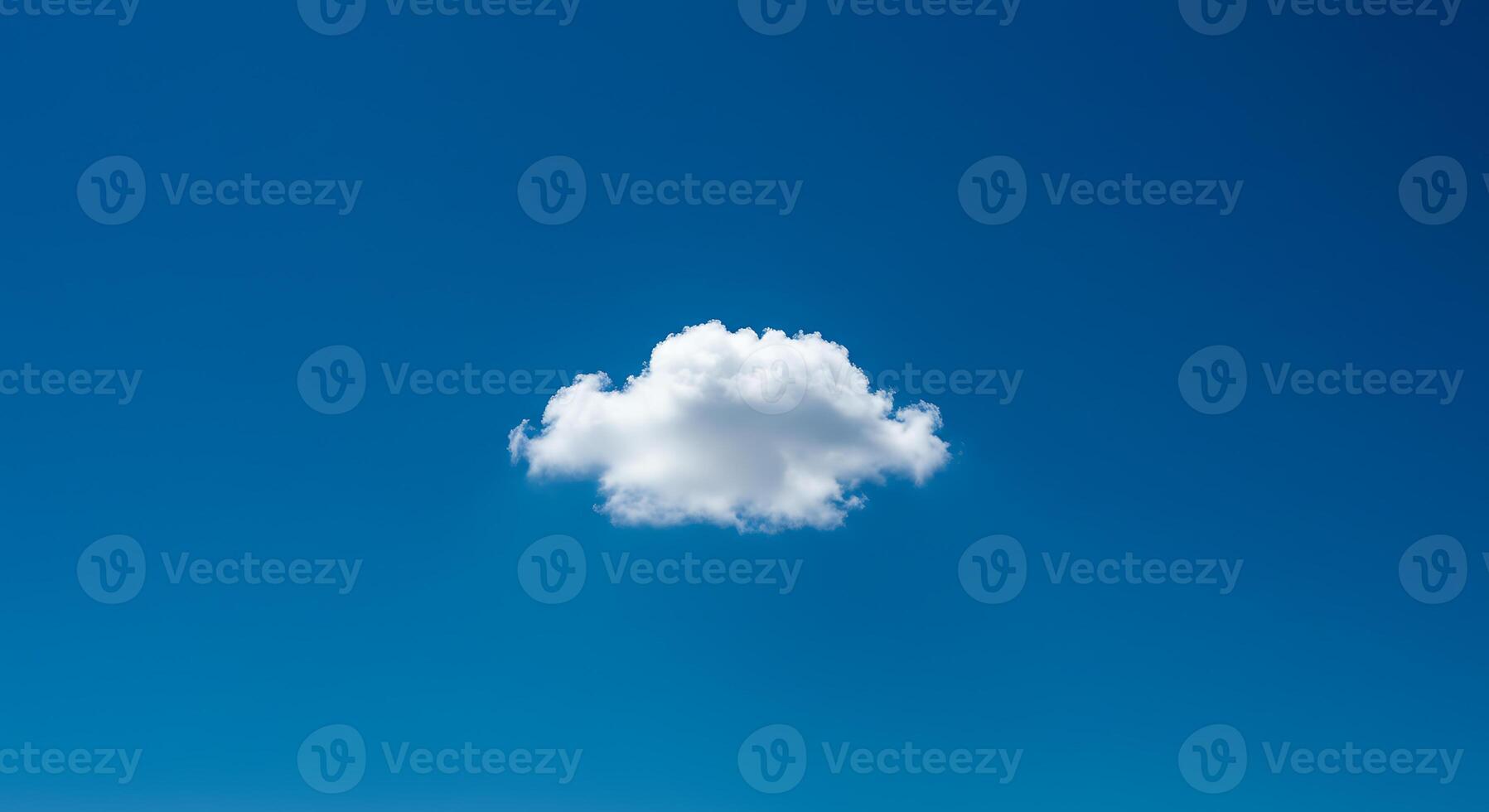 Single cloud in blue sky photo