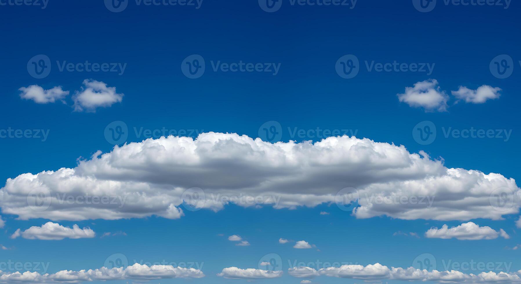 A large field with clouds in the sky photo