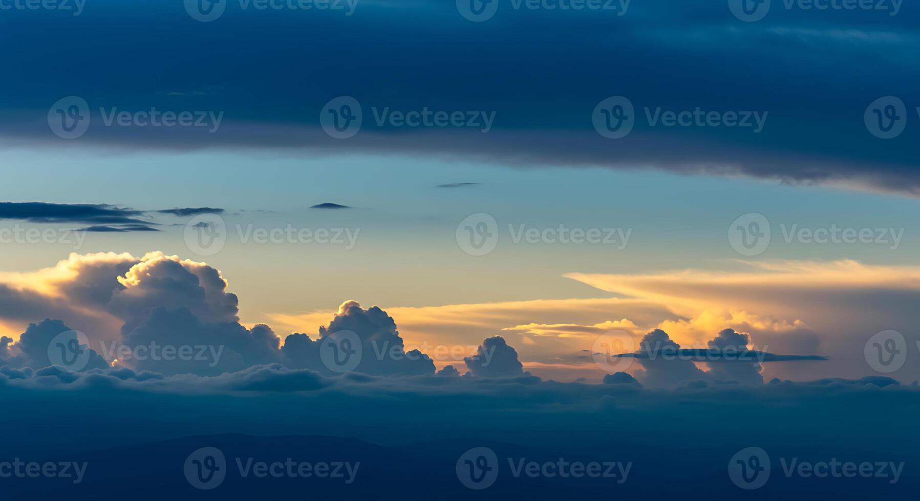A beautiful sunset over the mountains with clouds photo