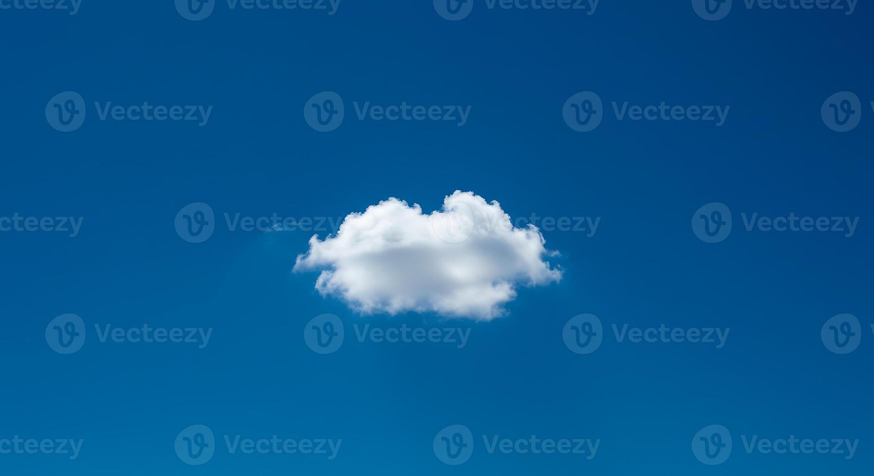A single cloud floating in the blue sky photo