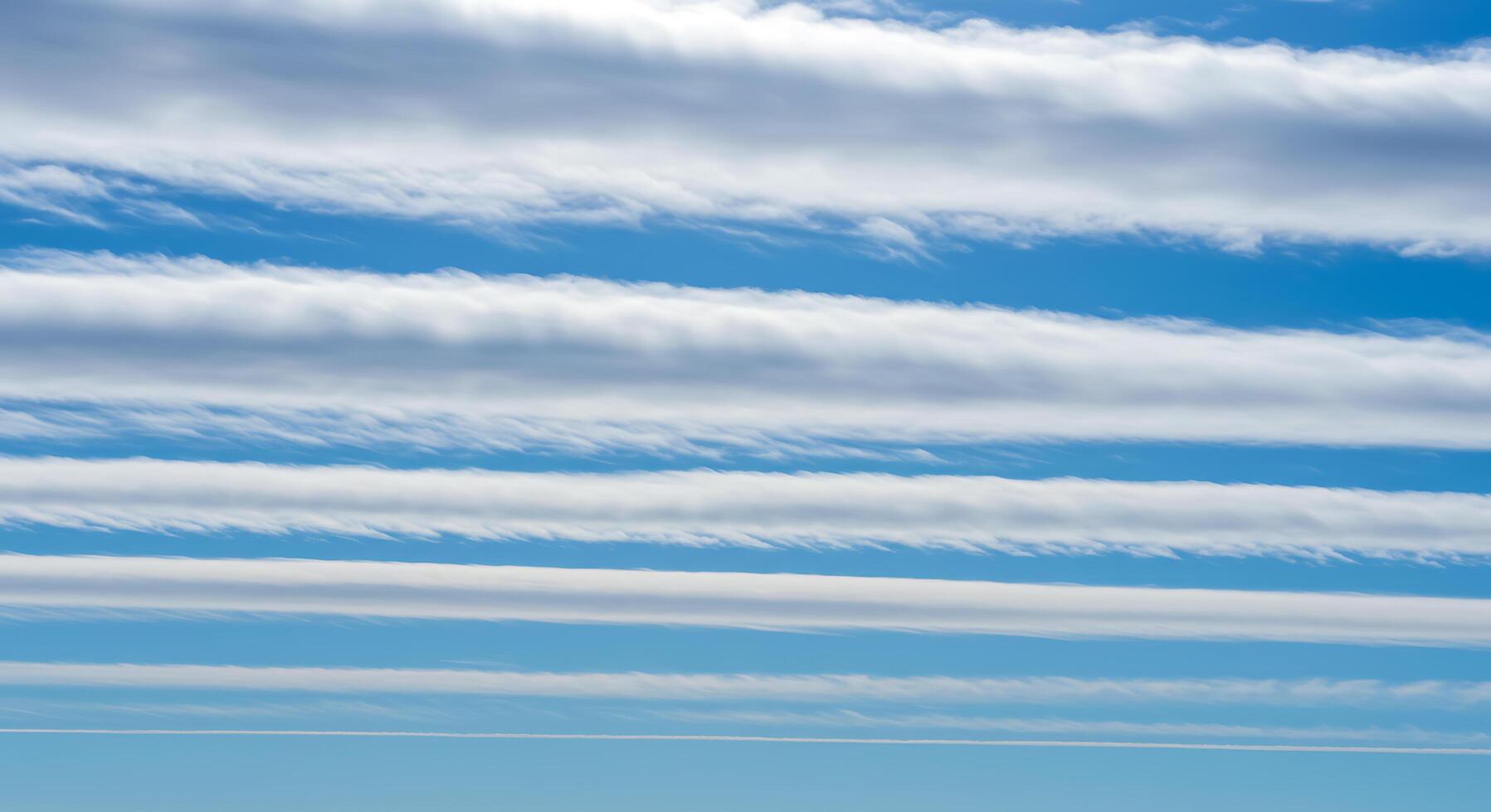A person flying a kite in the sky photo