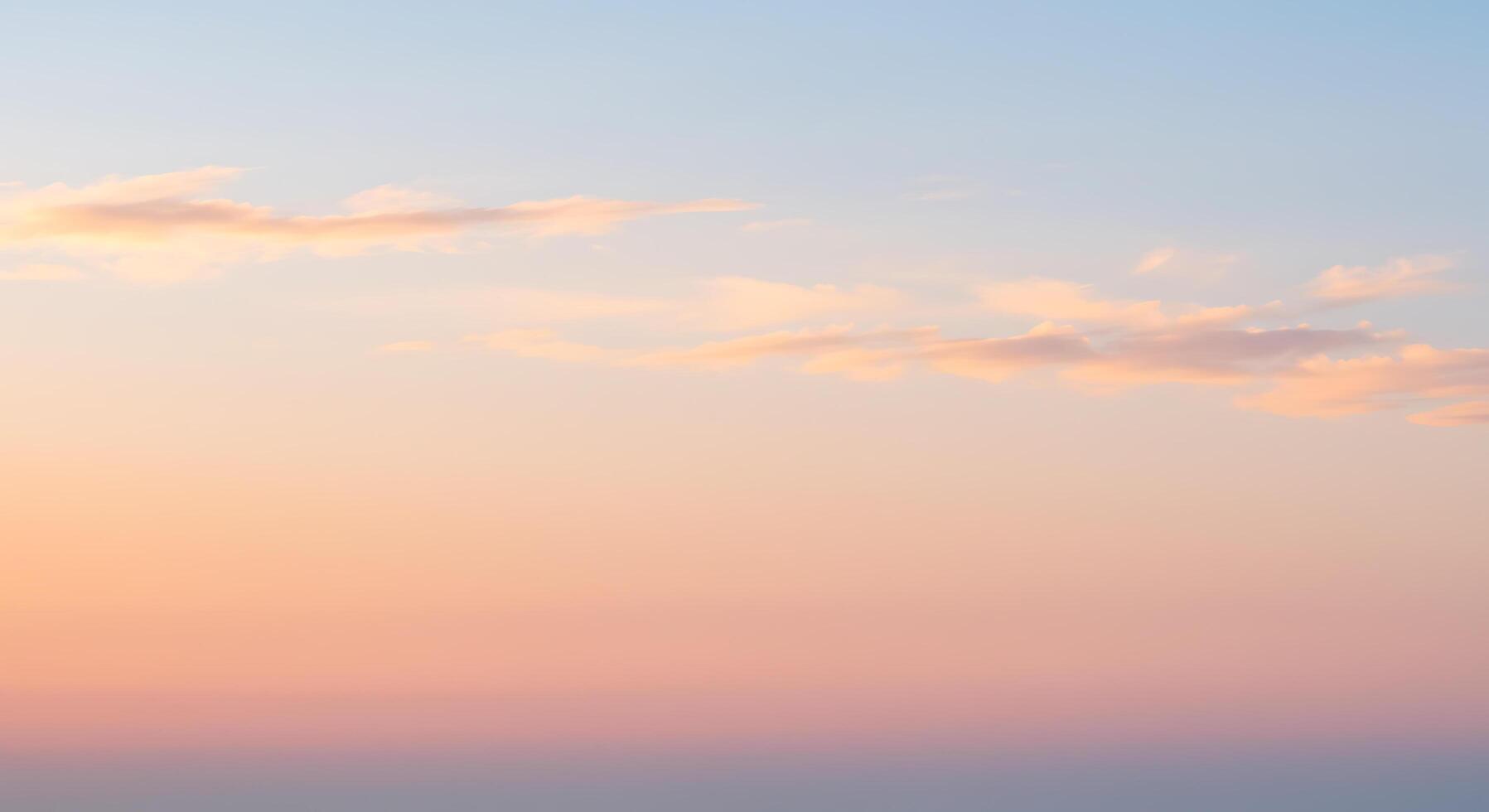 A man is standing on a hill with a plane in the background photo