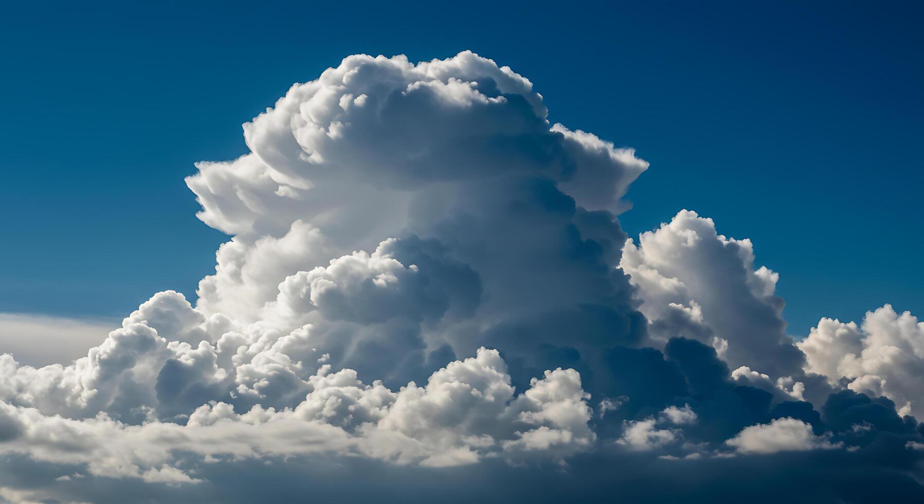 Towering Cumulonimbus Cloud against a Blue Sky photo