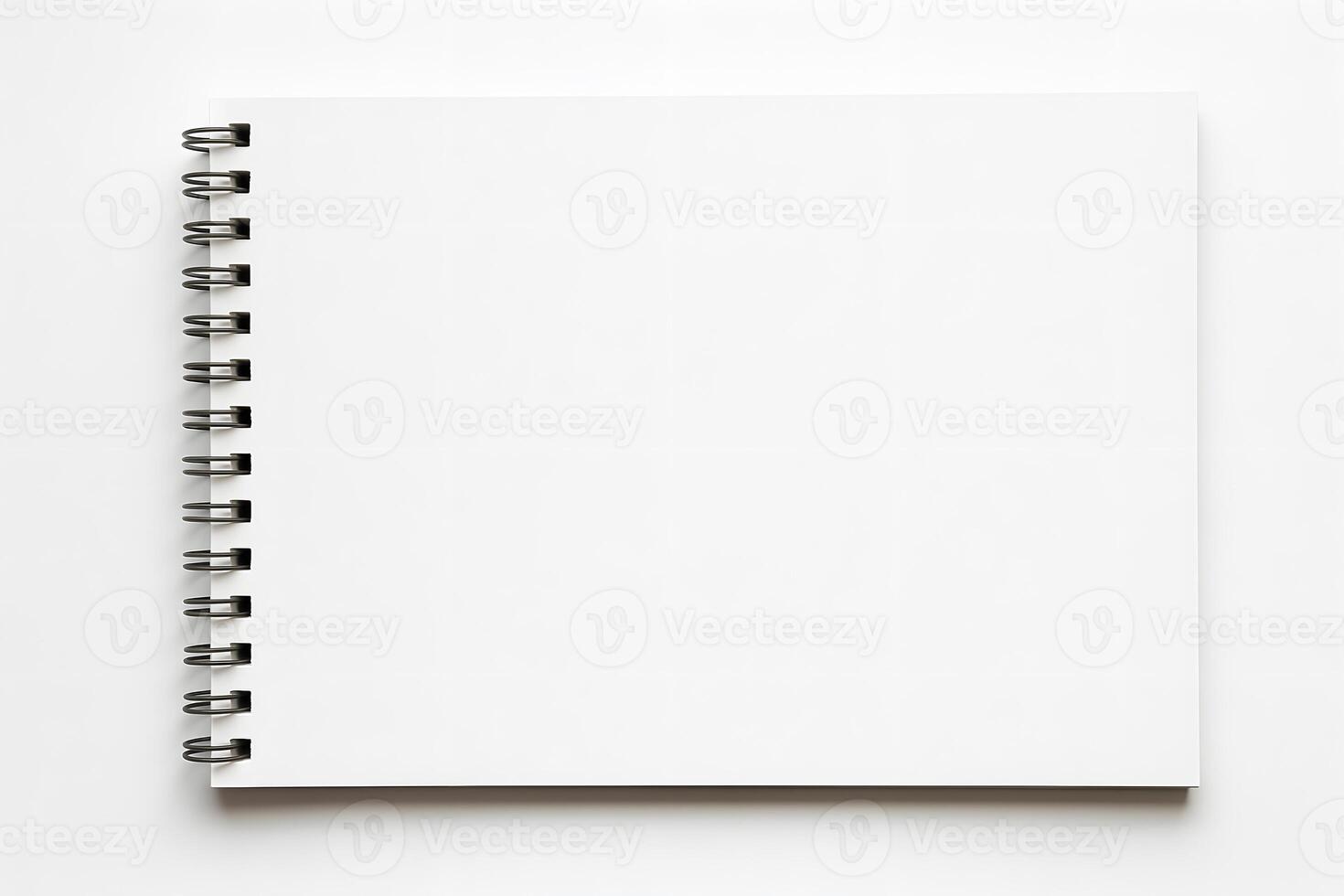 An open notebook with a blank page on a white background photo