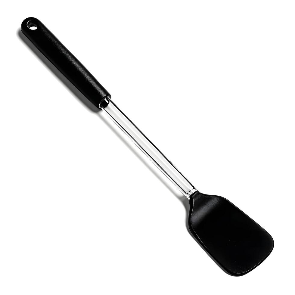 A black spatula on a white surface photo