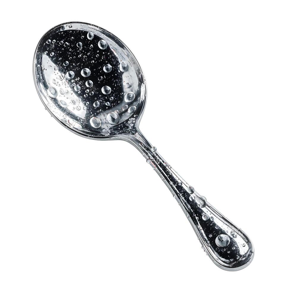 A silver spoon with water droplets on it photo