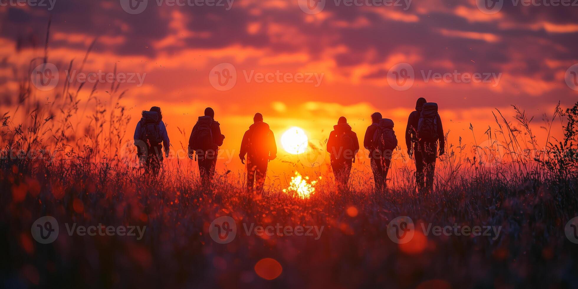 a golden sunset over a Lughnasadh celebration, silhouetted figures around a fire in a rural field, with dramatic lighting and a clear area on the right for copy placement photo