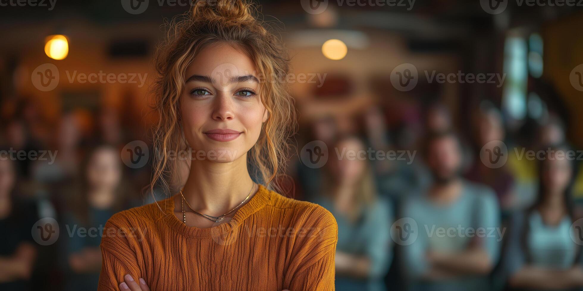 a woman standing confidently in front of a volunteer group at a community shelter, giving a motivational speech, with warm lighting and space on the right for informational text photo