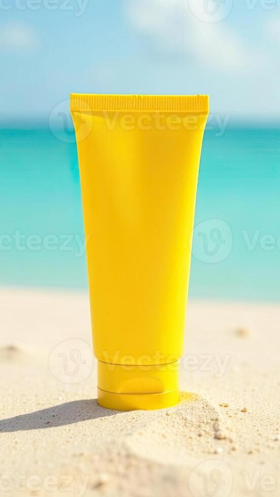 A yellow tube of sunscreen on the beach photo