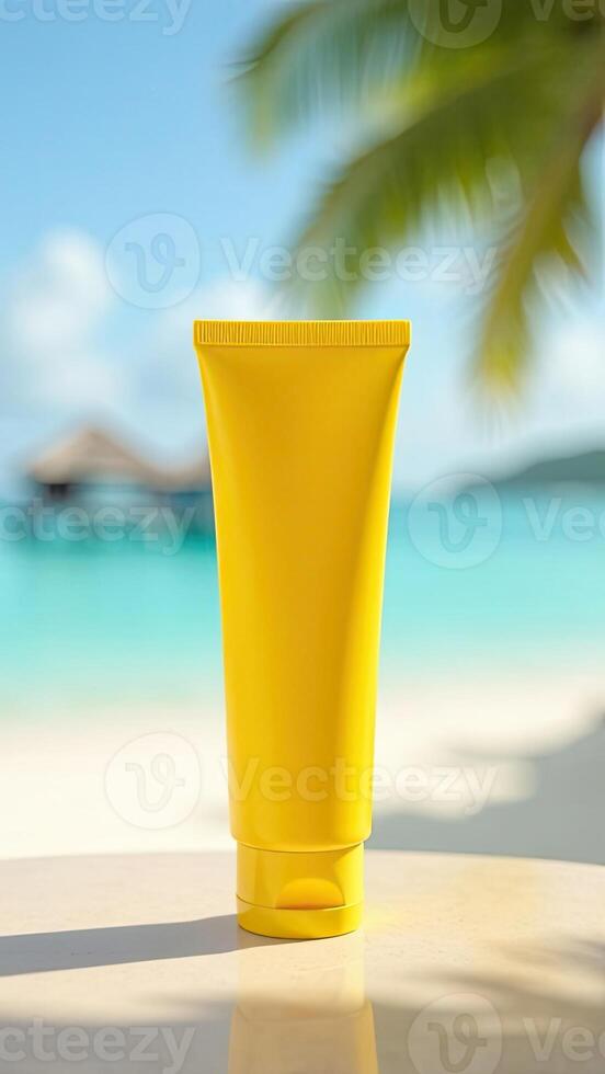 A yellow tube of sunscreen on a table in front of a beach photo