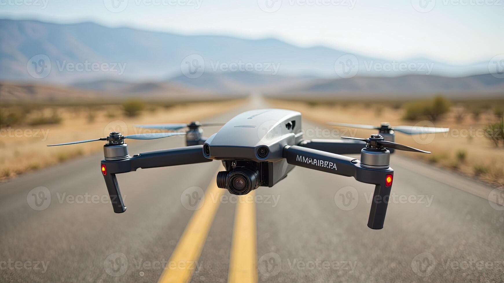 Drone in Flight Over Deserted Road with Mountains in Background photo