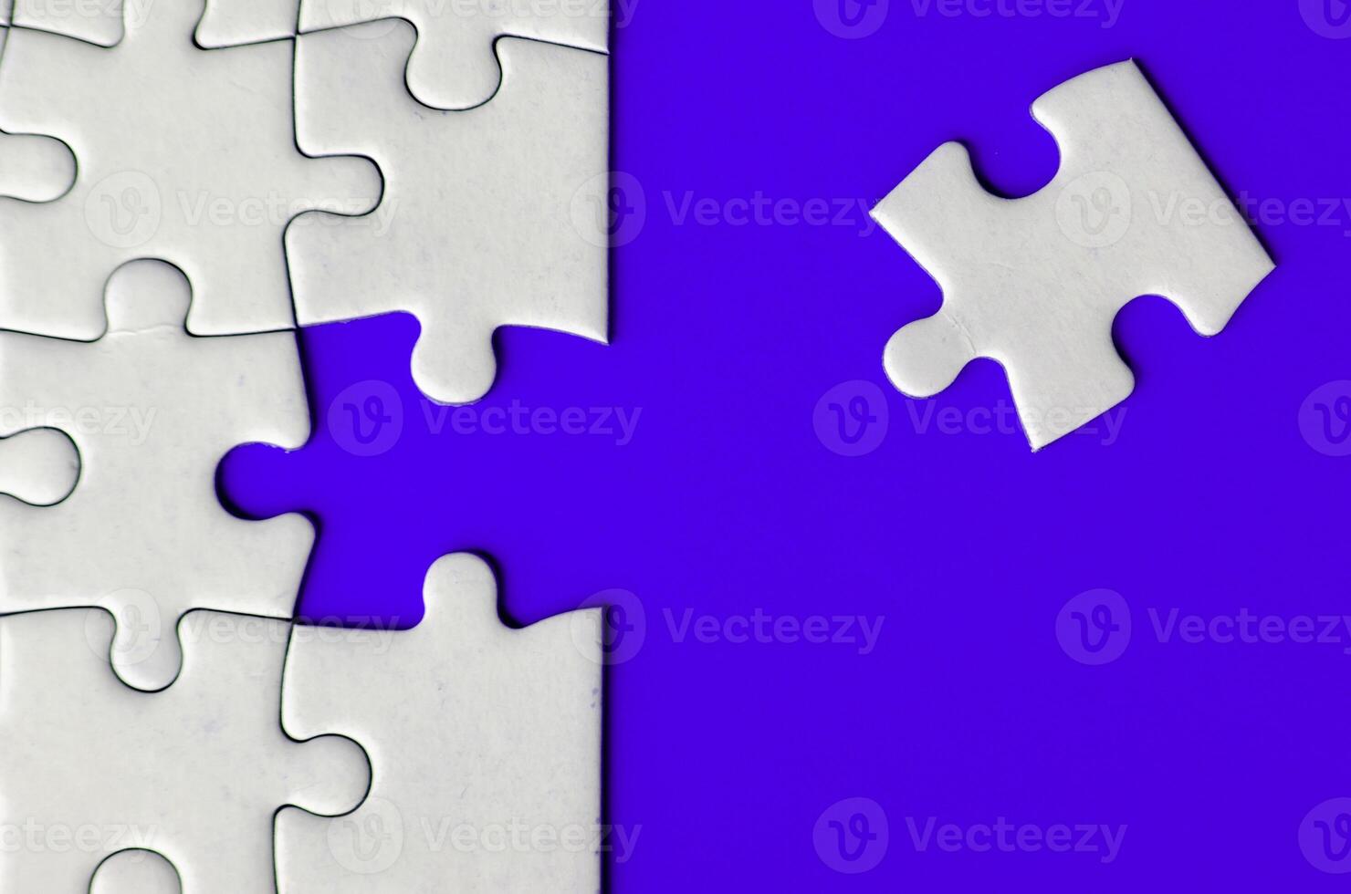 Connecting missing white jigsaw puzzle symbolizes partnership and unity on blue background photo