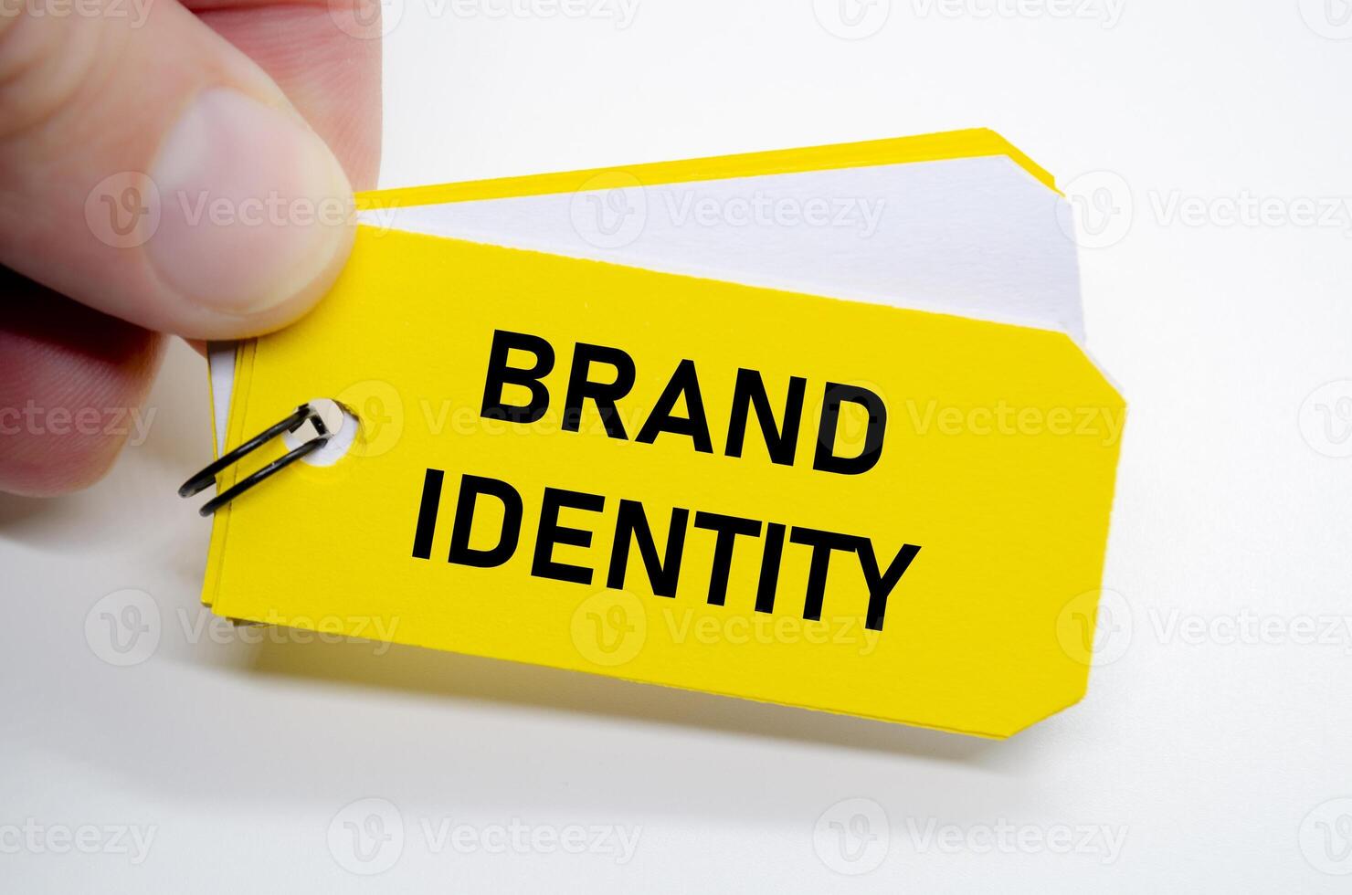 Brand identity note highlighted on yellow sticky, emphasizing core visual and verbal values. photo