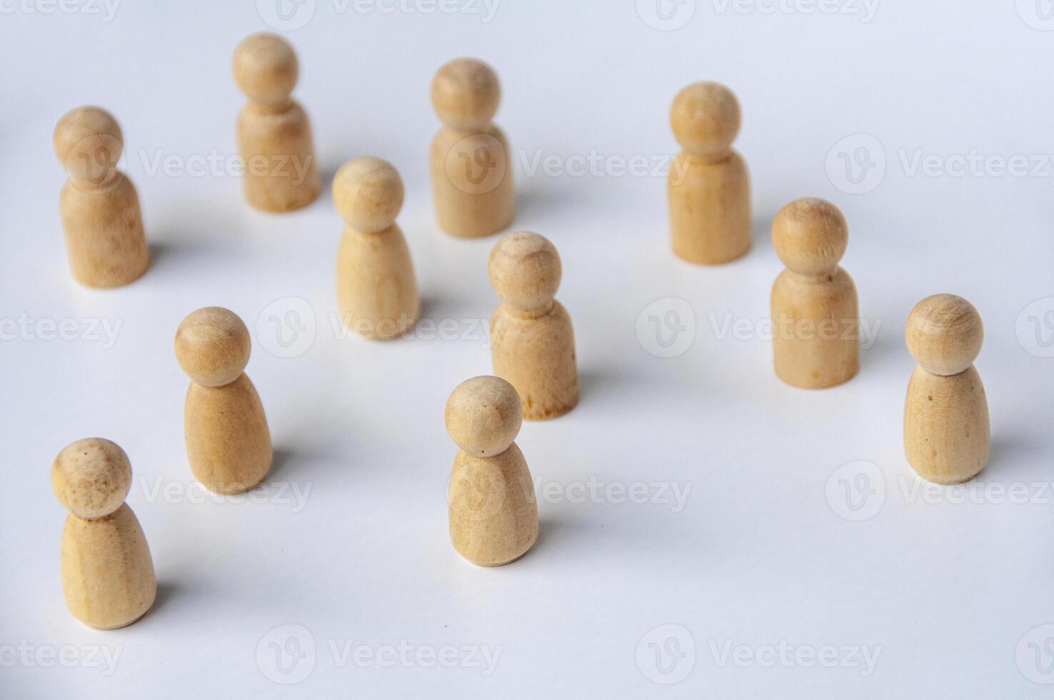 Top view of wooden dolls with customizable space for text or ideas. Leadership and copy space concept photo