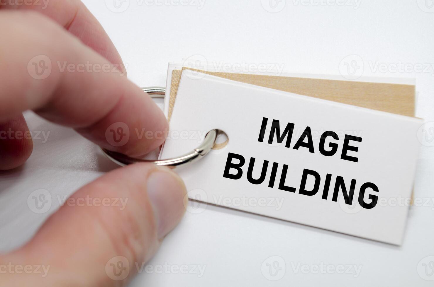 Image building slogan on white note suggesting reputation creation and consistent branding practices. photo