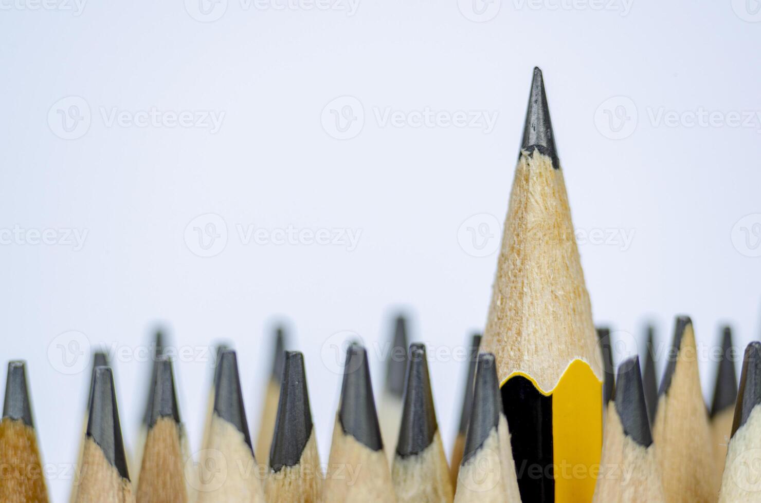 A pencil standing out from the rest representing Courage or Leadership with customizable space for text photo