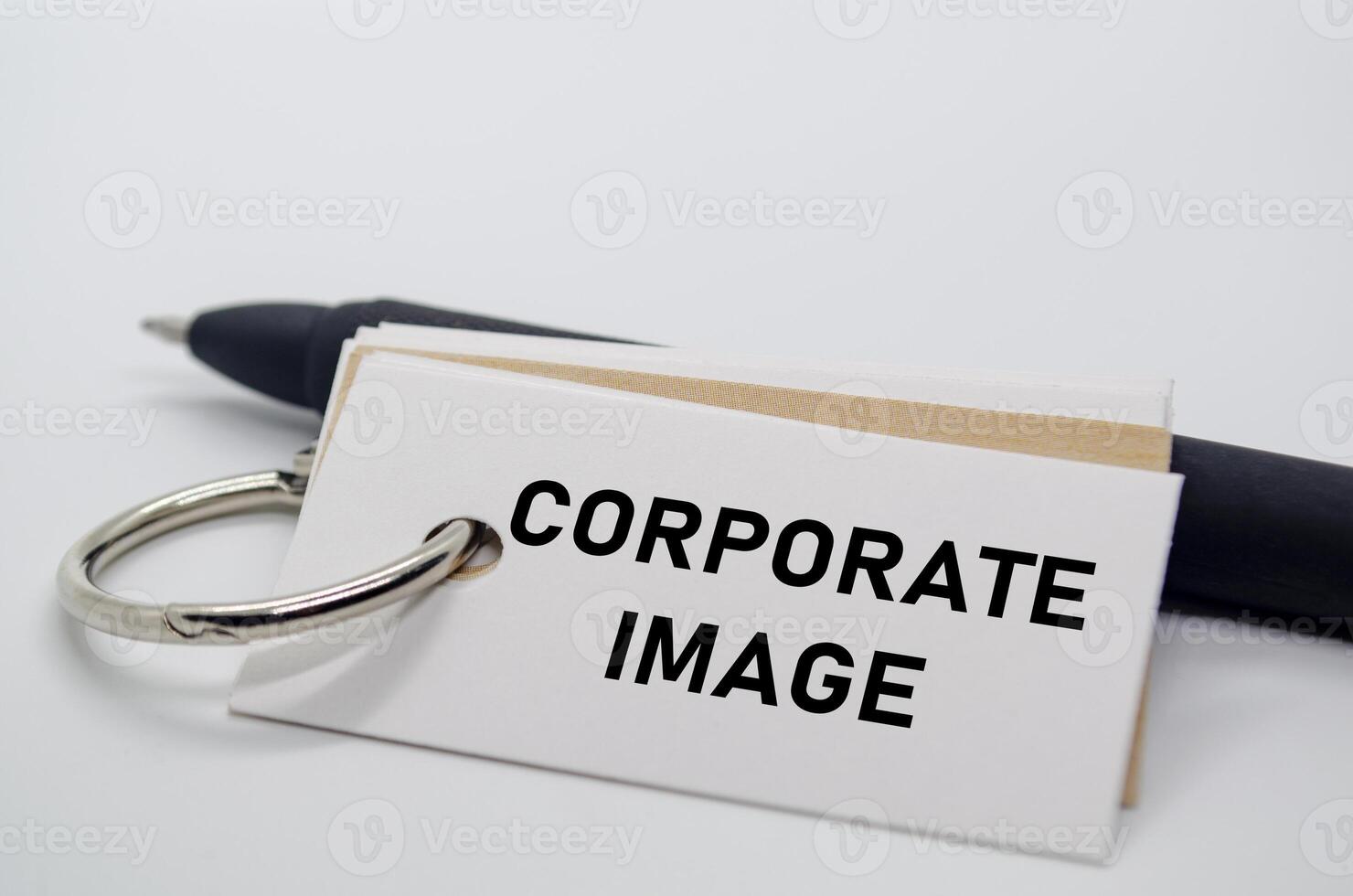 Corporate image label on white notepad representing business branding and company perception. photo